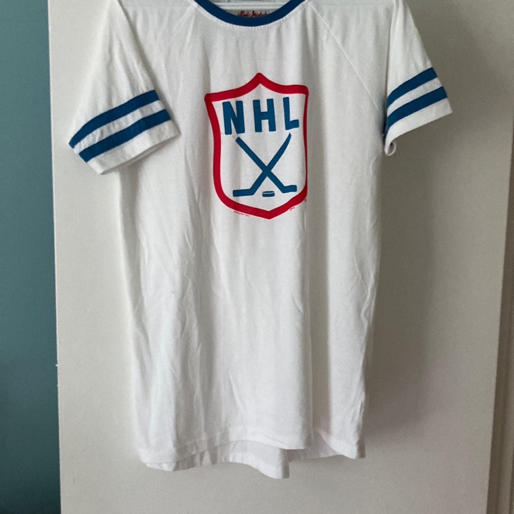 White NHL shirt. Red Jacket from 2017. Part of their vintage hockey line.